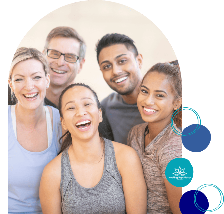 Diverse group of people smiling together in a fitness class, embodying the community support found at Altamonte Springs depression therapy groups.