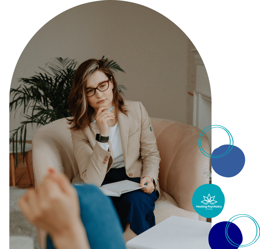 A thoughtful psychiatrist from Oviedo Psychiatric Services is engaged in a session, reflecting the attentive and personalized care offered at Healing Psychiatry of Florida.